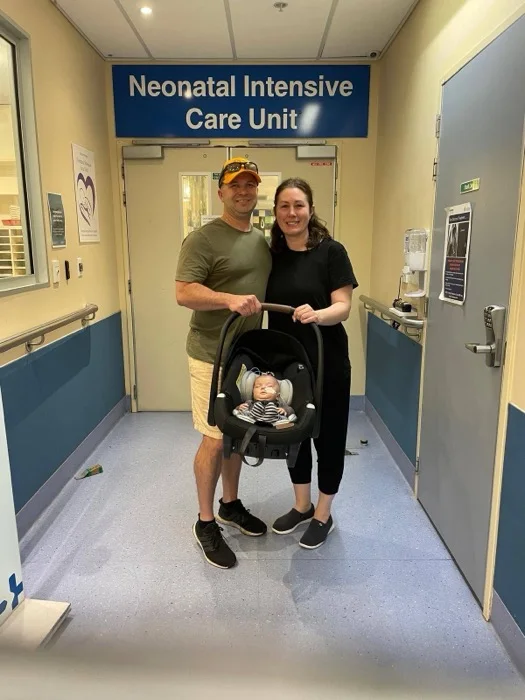 JB Rawls with his wife and newborn son